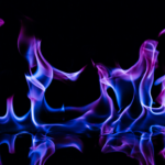 photo of purple and blue flames on a black background